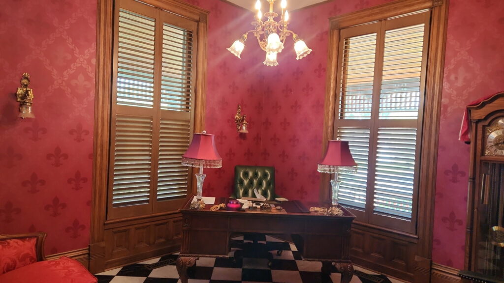 Hunter Douglas everwood faux wood blinds in a pink, eclectic office