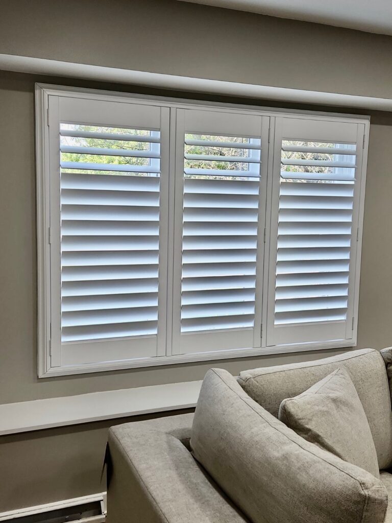 hunter Douglas plantation shutters in large family room window