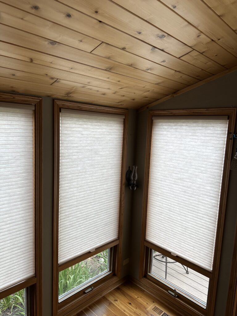 hunter Douglas duette cellular honeycomb shades hanging in a Warrenville, IL sunroom