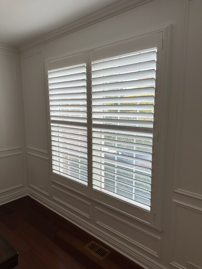 Hunter Douglas Plantation Shutters installed in an elegant, empty room.