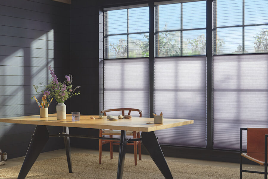 Hunter Douglas Duette Duolite Cellular Shade hanging in a modern, artistic work space