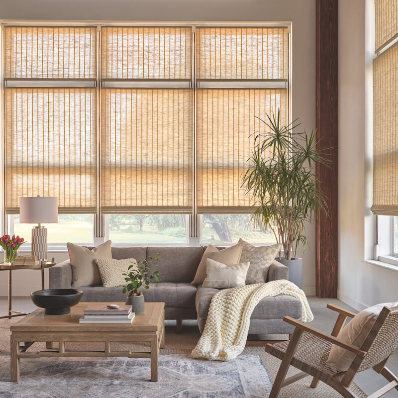 Woven wood shades in a neutral living room