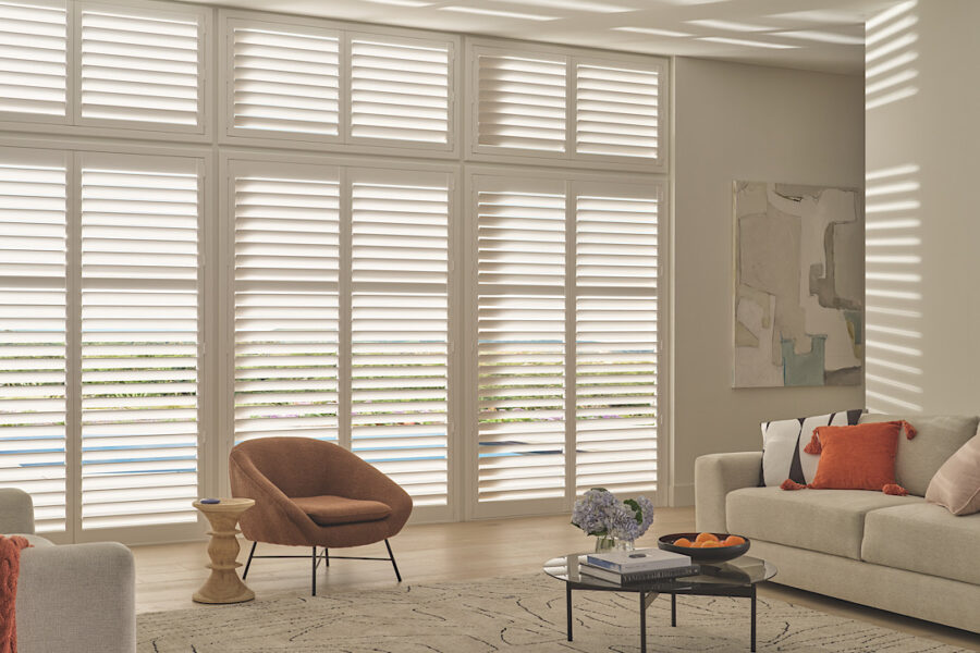 Hunter douglas shutters in neutral living area.