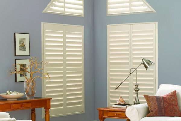 Triangle windows with hunter douglas shutters