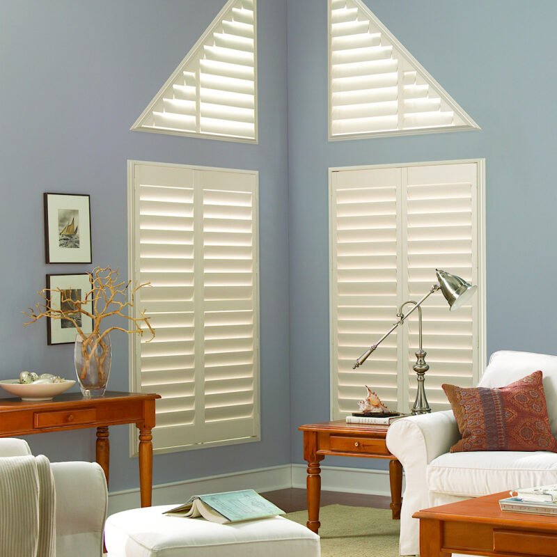 Triangle windows with hunter douglas shutters