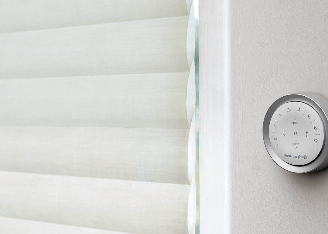 Hunter Douglas PowerView remote mounted to wall next to window