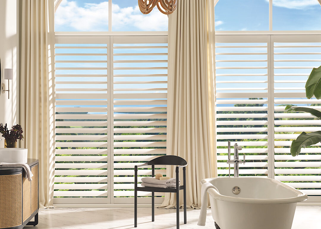 Hunter douglas custom shutters in bathroom arched window