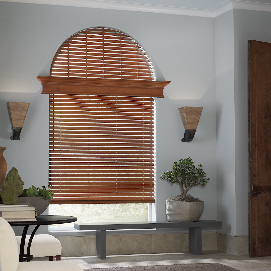 Hunter douglas wood blinds in an arched window