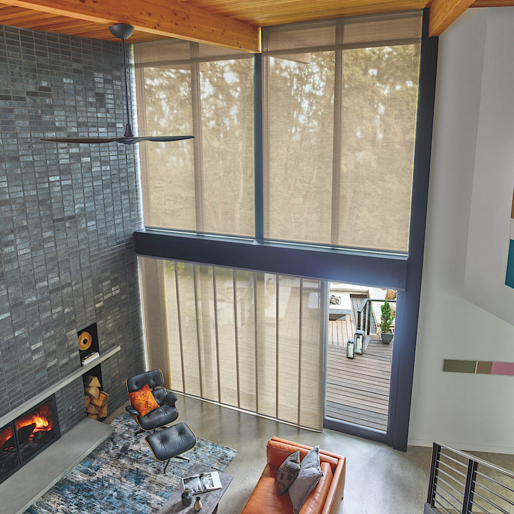 Skyline panel track blinds by hunter douglas over a sliding glass door