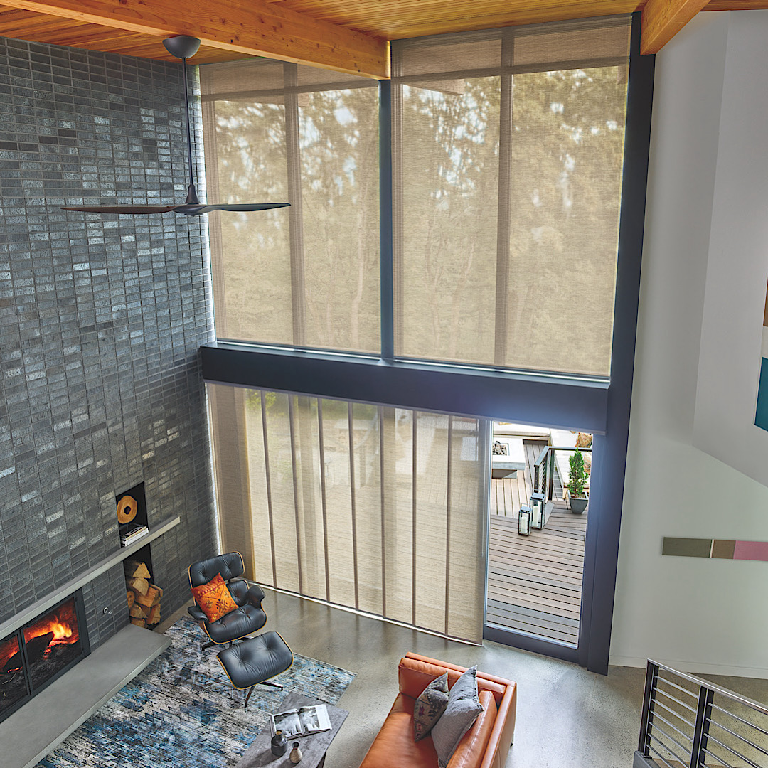 Skyline panel track blinds by hunter douglas over a sliding glass door